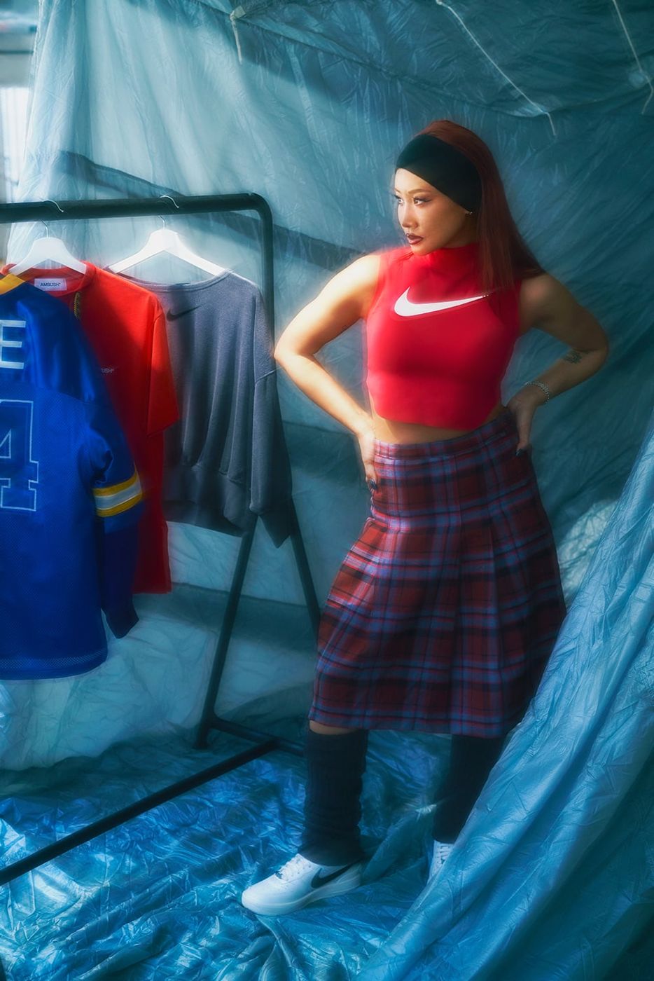 Yoon Ahn in red Nike top and plaid skirt